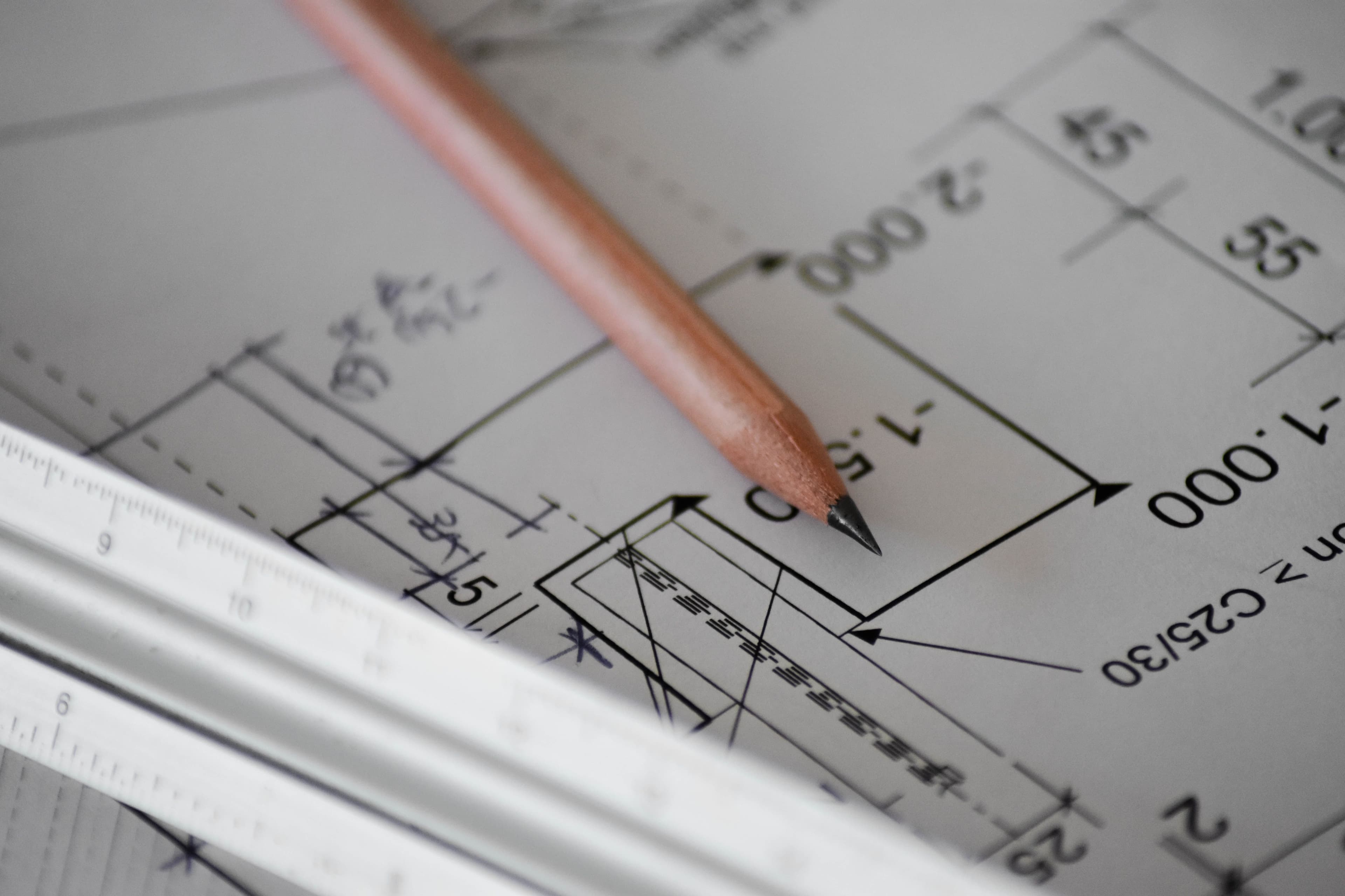 an architectural drawing on white paper with a pencil